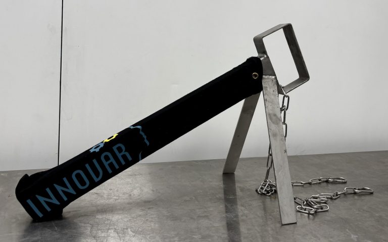Innovar Ditch Magnet with fabric debris collection sleeve, standing in the ditch on its own legs